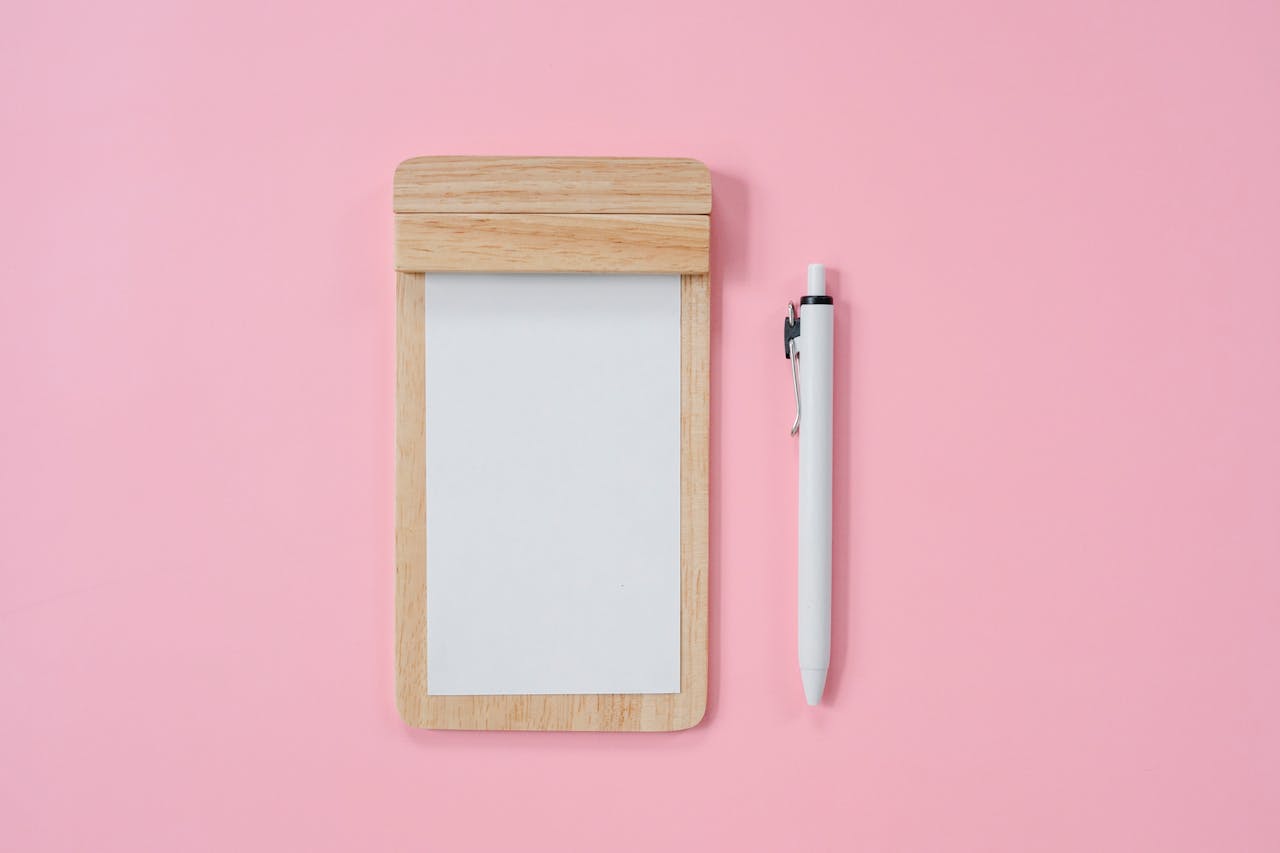 Modern stationery on pink background
